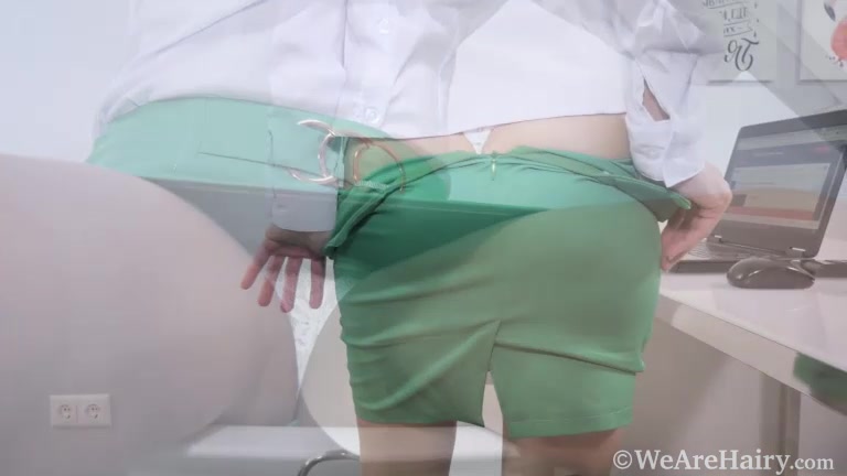 Cathy masturbates while working on her laptop