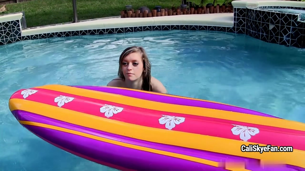 Joyful well shaped Cali Skye is dresses off in the pool