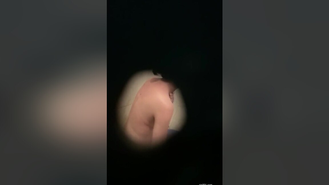 A covert camera captures a black-clad Asian whore.