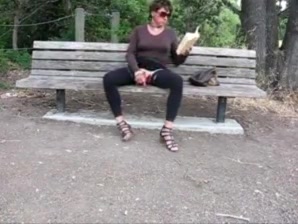 Lovely crossdresser jerks it on a park bench