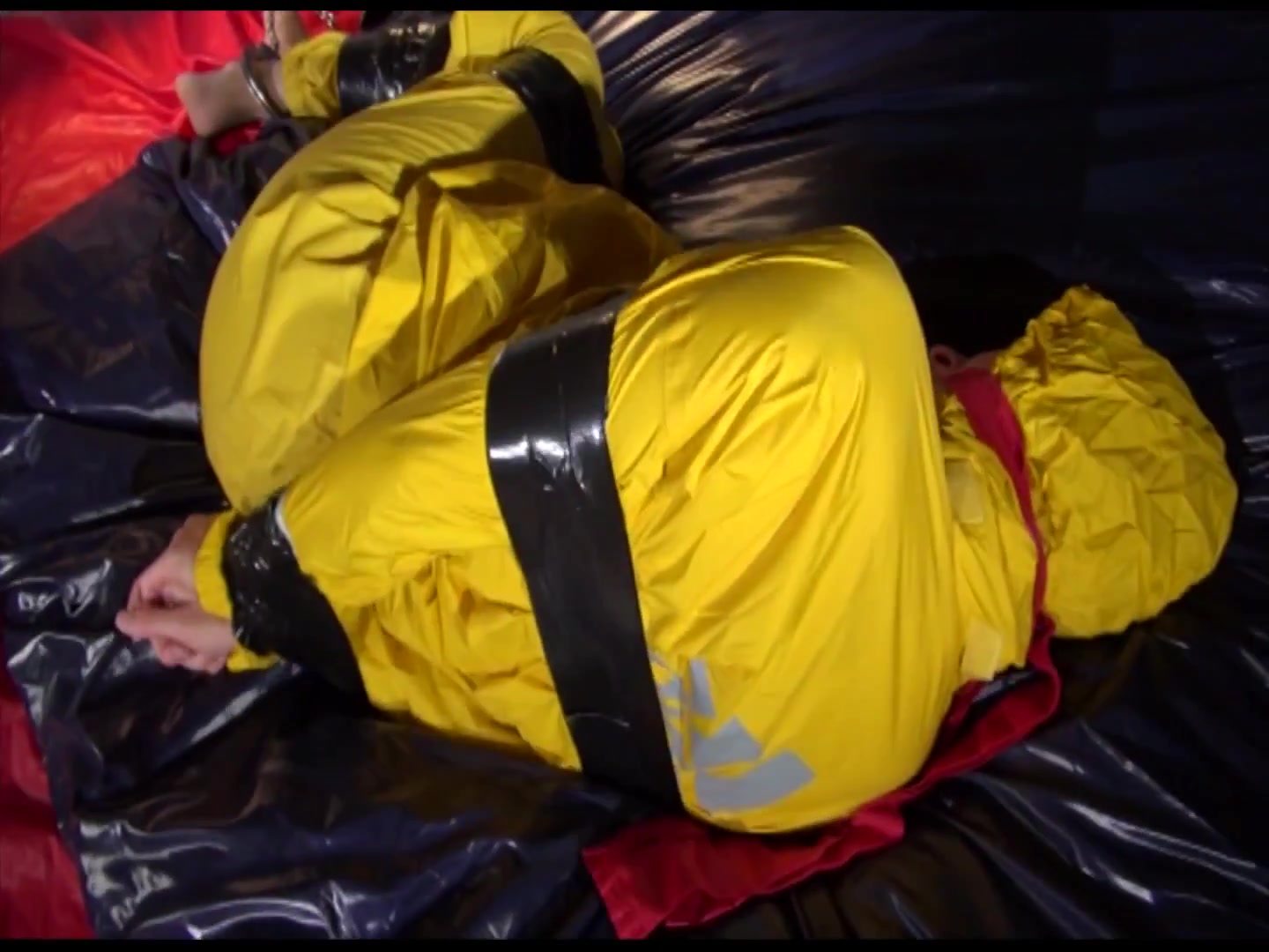 Get 2 Archivevideos With Sonja Enjoying Bondage In Her Shiny Nylon Rainwear