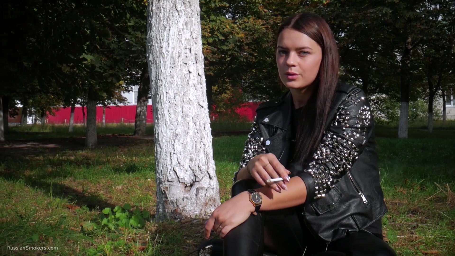 Pretty Faced Asya Is Smoking A Cigarette Outdoors