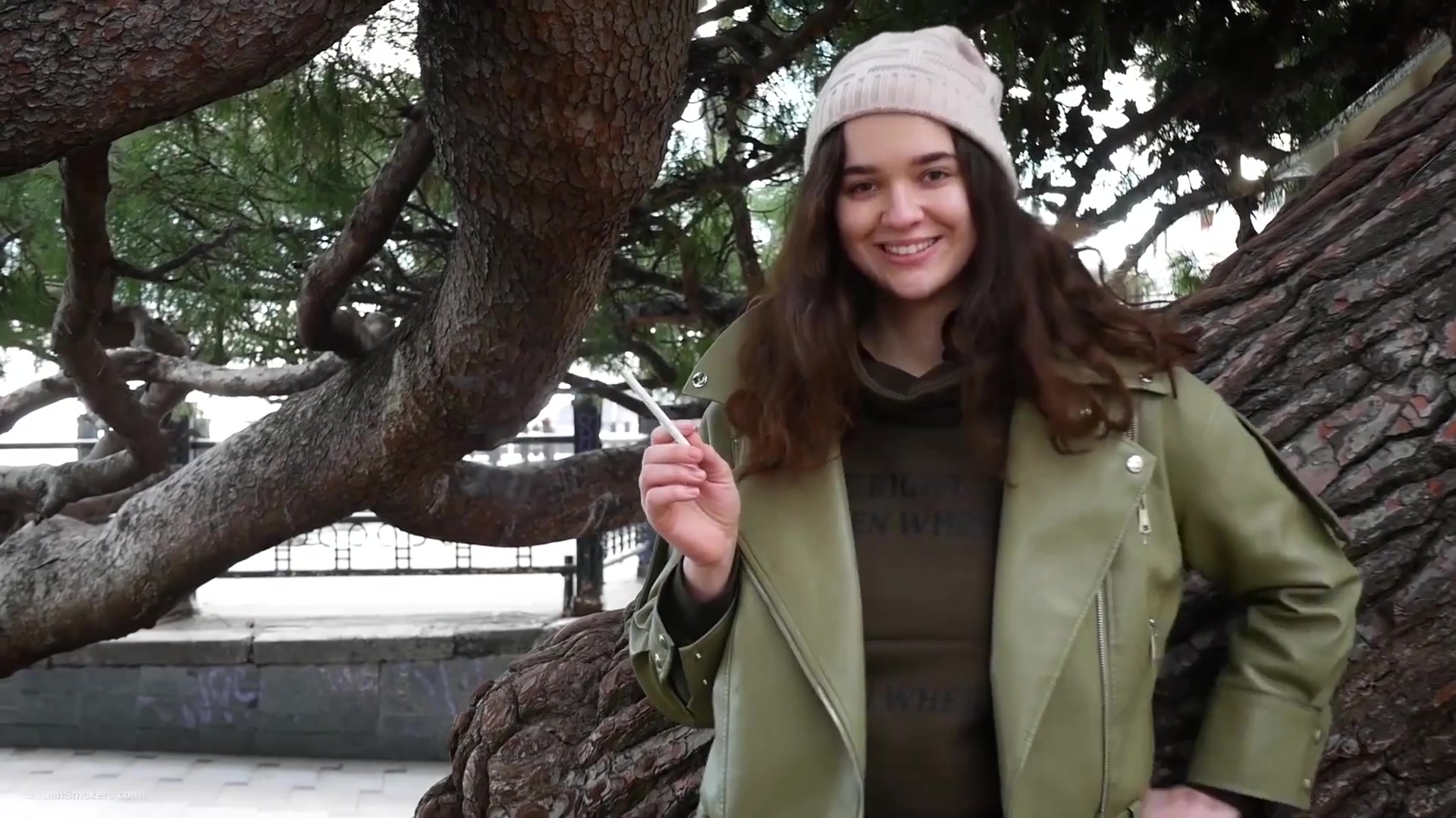 Young Brunette Is Taking An Unhurried Stroll With Allwhite 120mm Cigarette