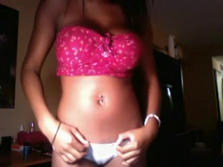 Chocolate-skinned boomshell in pink bra demonstrating her details