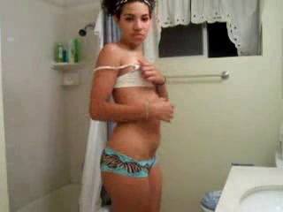 Young small-titted girl filming in the shower