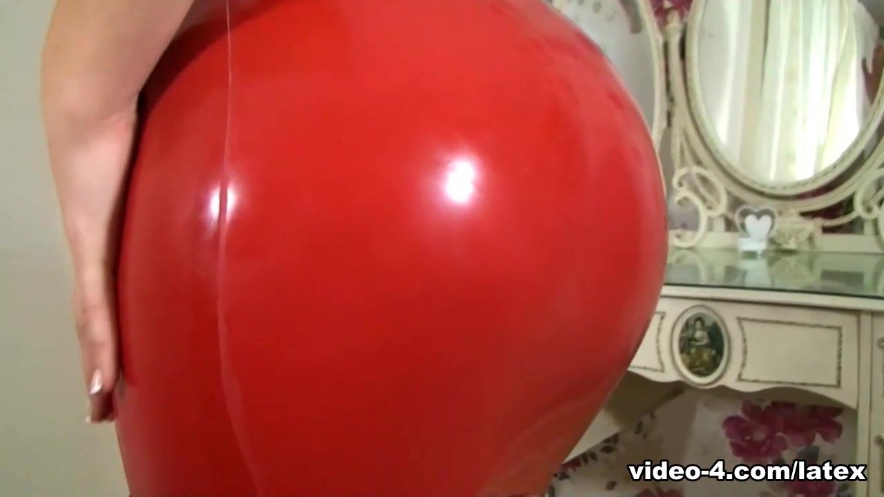 Katie Lou in Red Dress and Black Stockings - LatexHeavenVideo