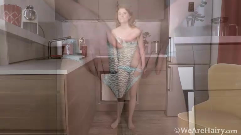 Emaza enjoys stripping nude in her kitchen