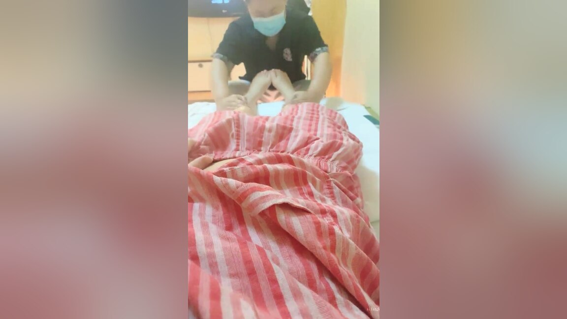 Asian masseur rubs clients clit and inserts her a sex toy