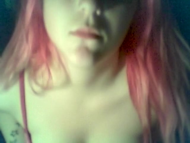 Red-haired emo babe showing her beautiful tits on camera