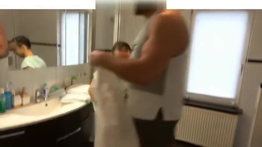 Giant muscle man shower with tiny small guy