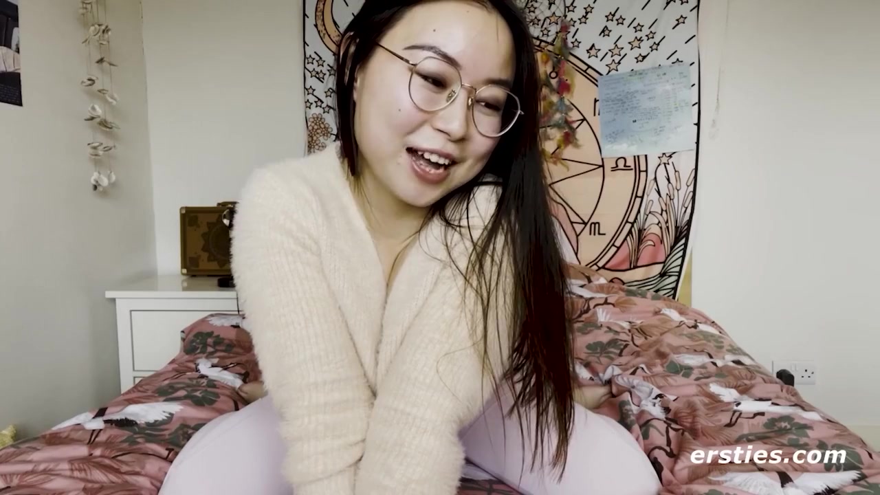 Cute Babe From China Rubs Her Shaved Pussy Before Grabbing A Dildo