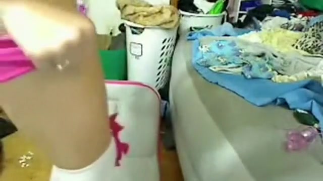Cute girl spreading her legs and stuffs her pussy with a sex toy
