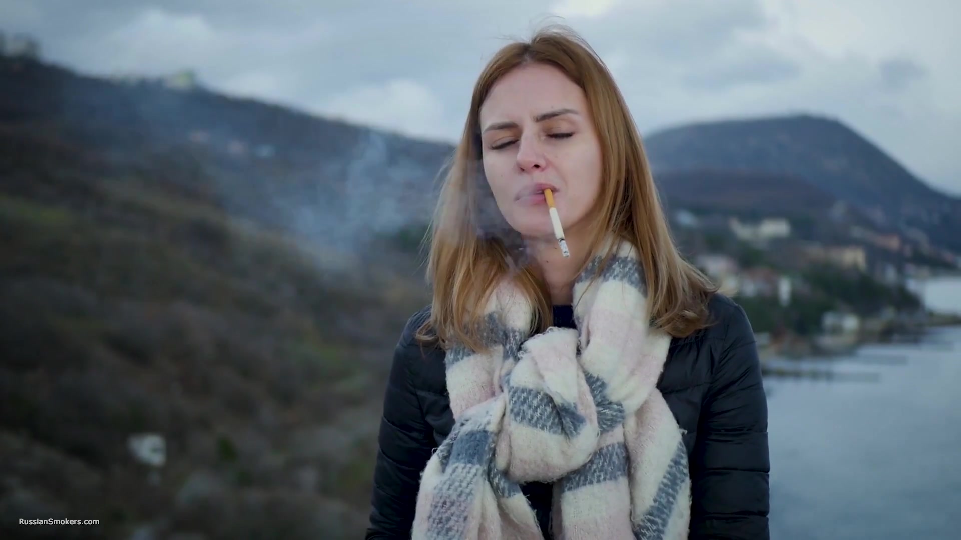 Beautiful Lady Is Smoking Two Saratoga Cigarettes In A Row On A Beautiful View