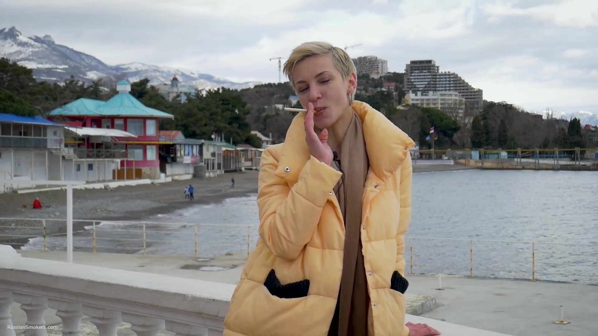 Short Cut Hair Blonde Girl Is Smoking Two Cork Cigarettes