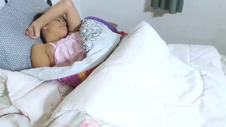 Amyra awakens in bed horny so she masturbates