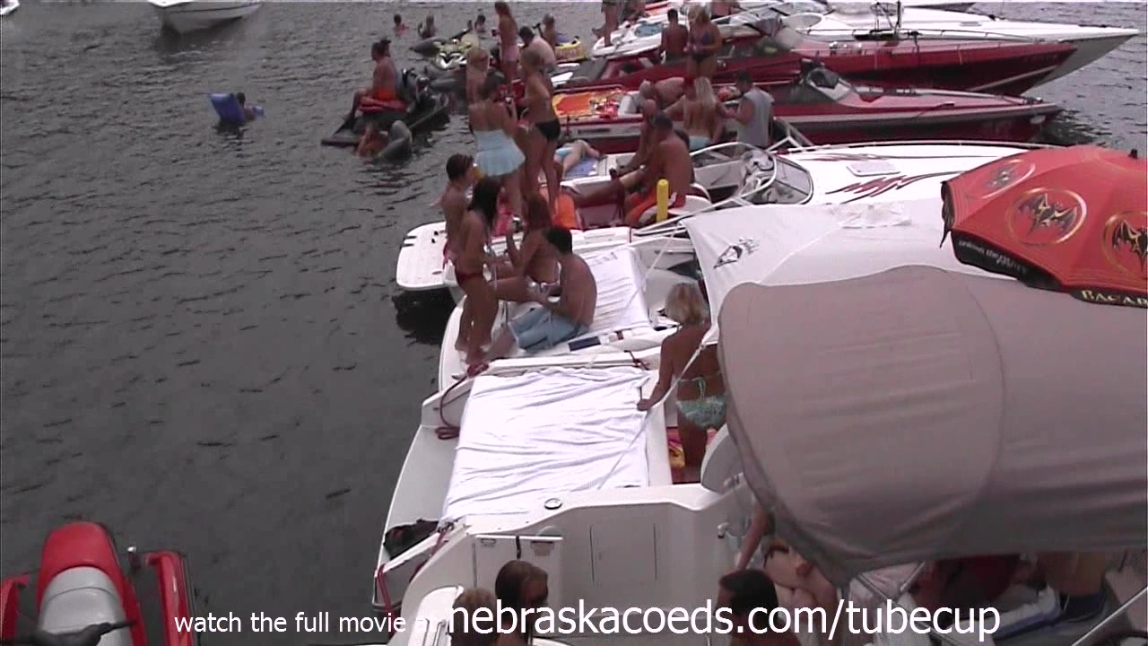 girls in bikinis and topless in public party cove