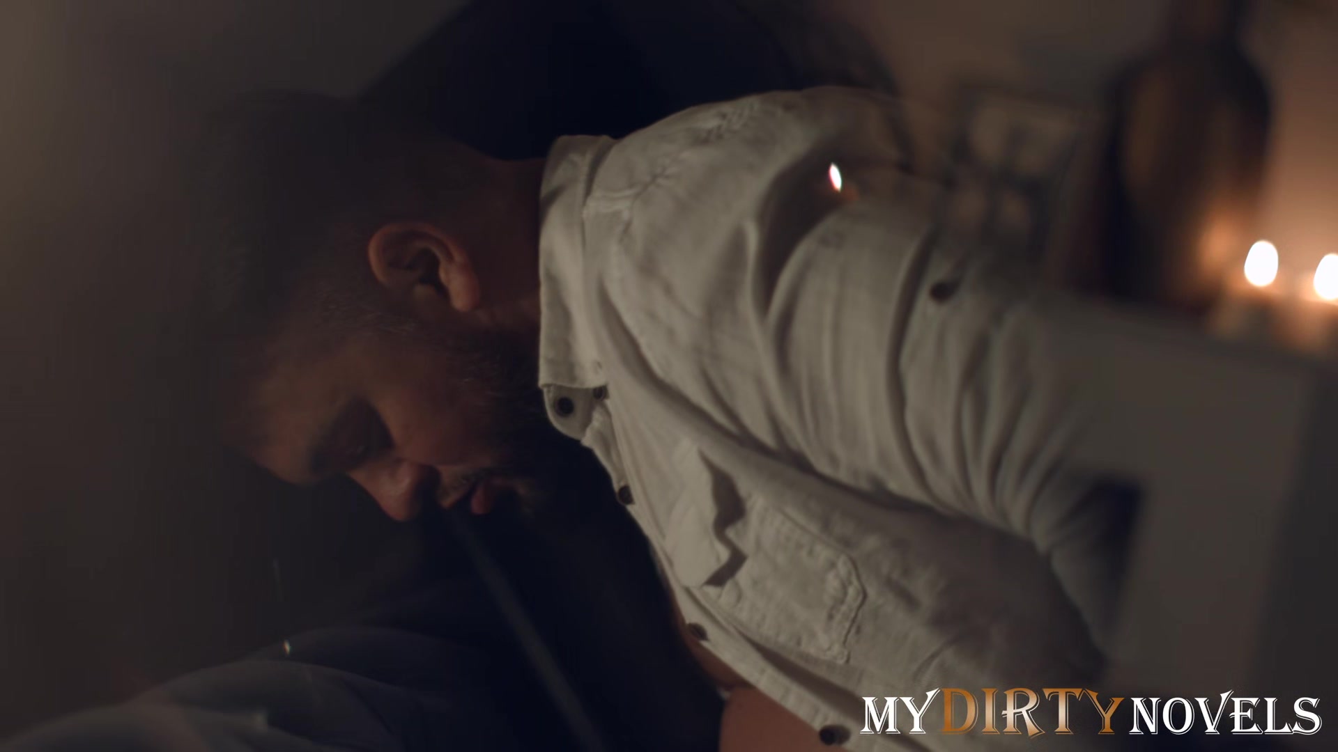 Sexual play of a couple in a dark room