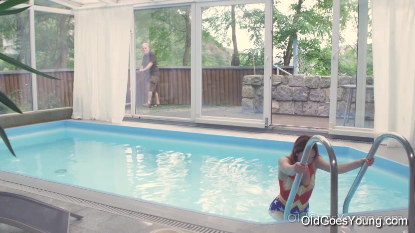 Cutie goes out of the pool to play with her pussy.