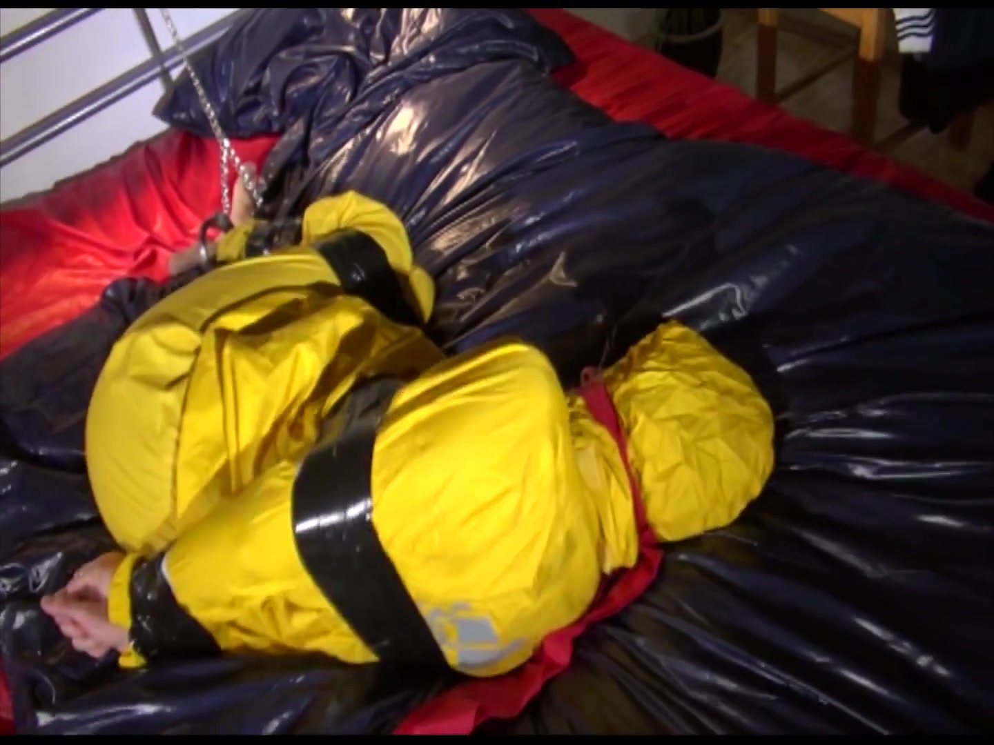 Get 2 Archivevideos With Sonja Enjoying Bondage In Her Shiny Nylon Rainwear
