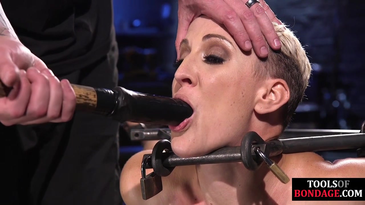 BDSM sub bound to floor and toyed with dildo and vibrator