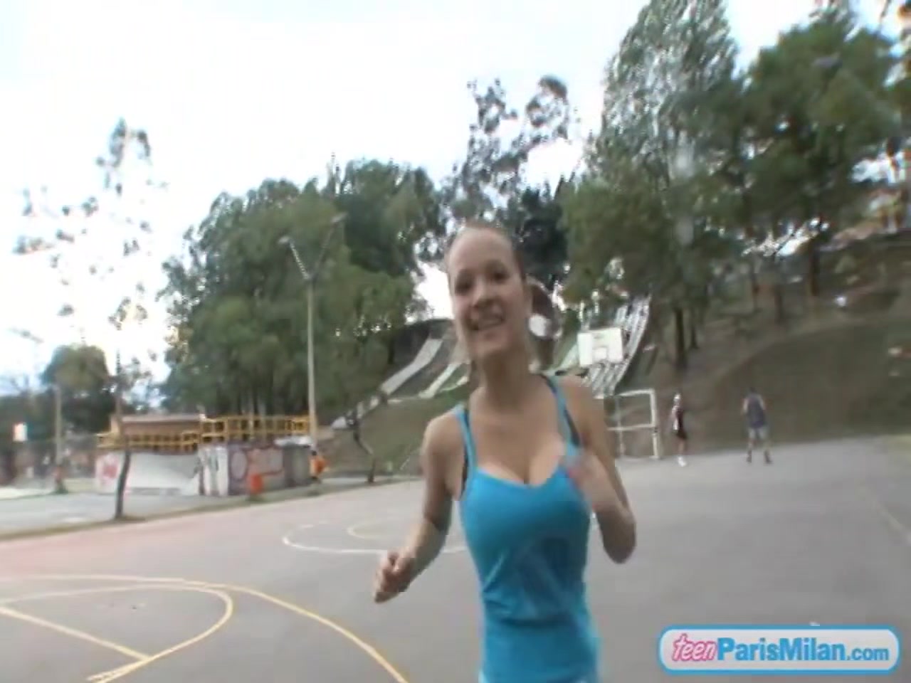 Paris Milan plays basketball outdoors