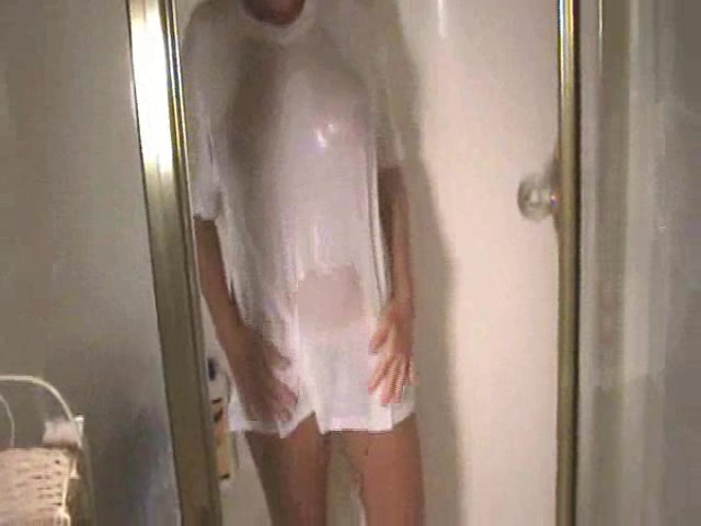 Skinny cute girl looks attractive in wet white T-skirt