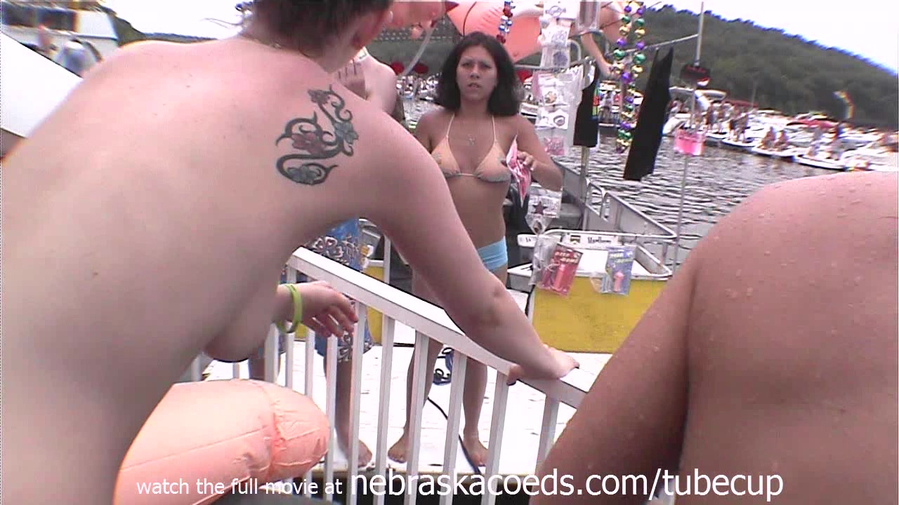 drinking beer out of plastic cocks while partying