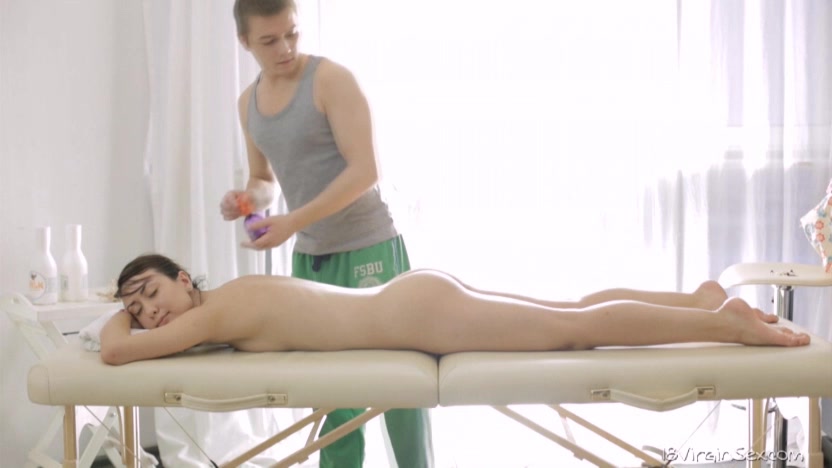 Ira moans with pleasure as her male masseuse rubs her sweet ass.