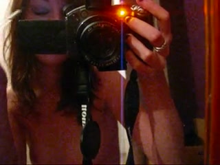 Mirror selfshot made by a naked slim-fit chick
