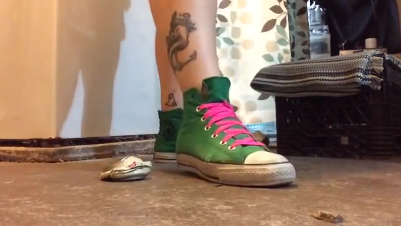 crushing cans with sneakers on