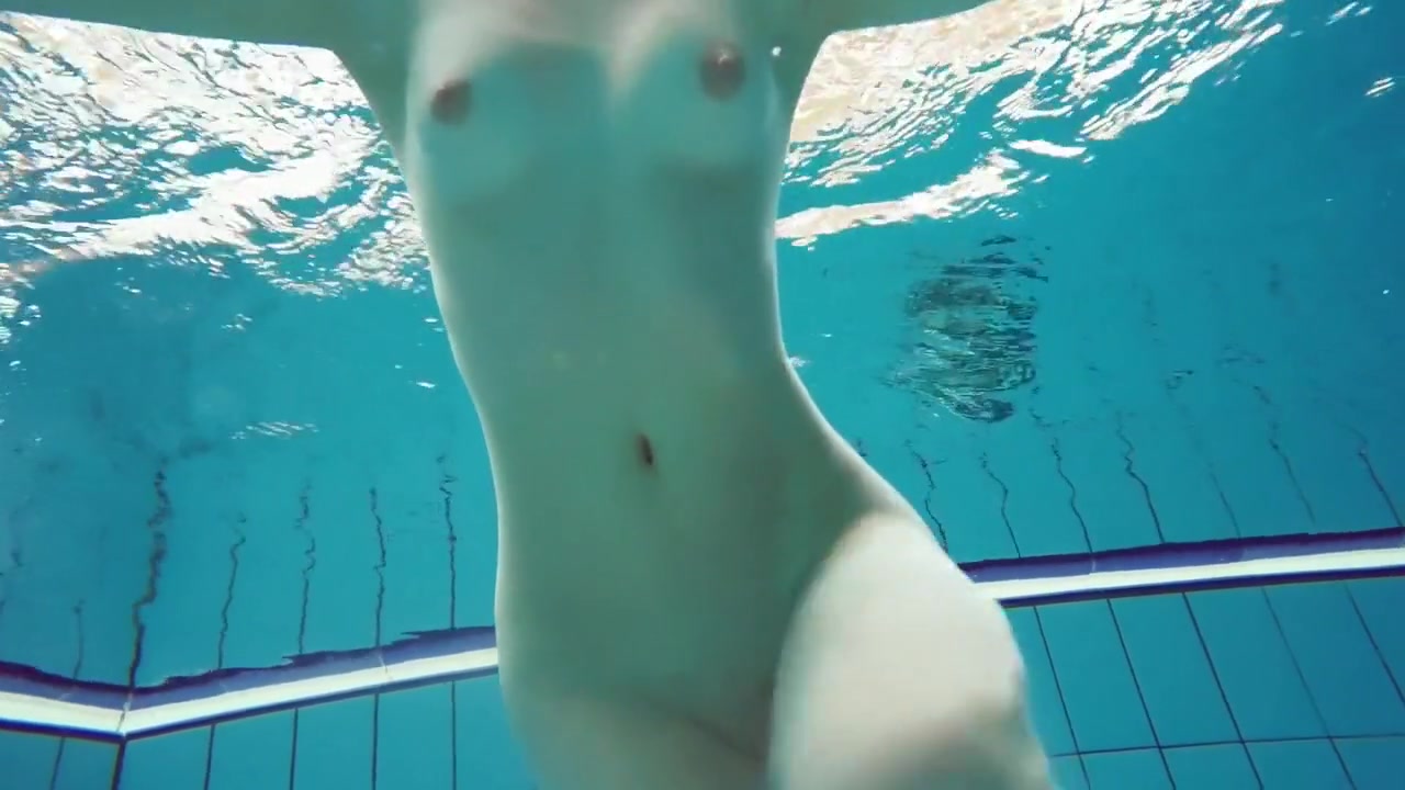 Dianas Redhead Beauty Enhances Her Swimming Grace