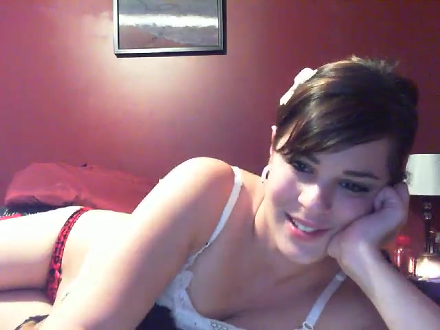 Short-haired Latina pleasing her pink hole with a toy