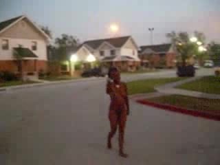 Curly black slut walks naked around the neighborhood