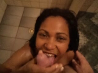 Hot slut giving blowjob under shower