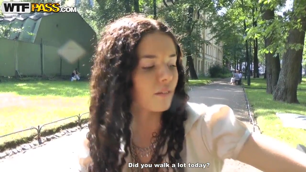 Cute curly brunette Leonora shows her boobs in park