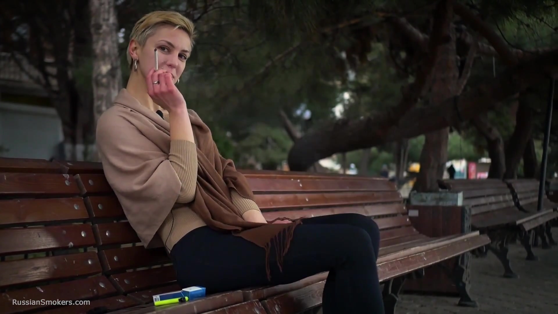 Short Cut Hair Blonde Girl Is Smoking All White 120mm Cigarettes