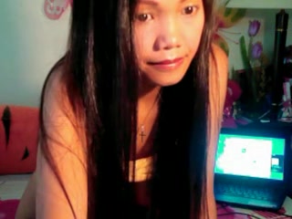 Cute Asian babe showing off her big boobs on camera