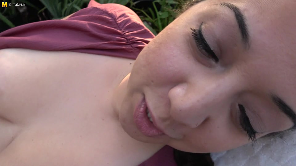 Mature nympho getting naked in the garden