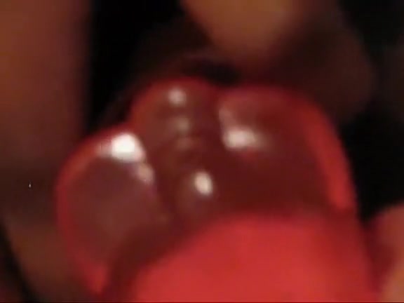 Sexy Ebony chick penetrating her hairy pussy with a red toy