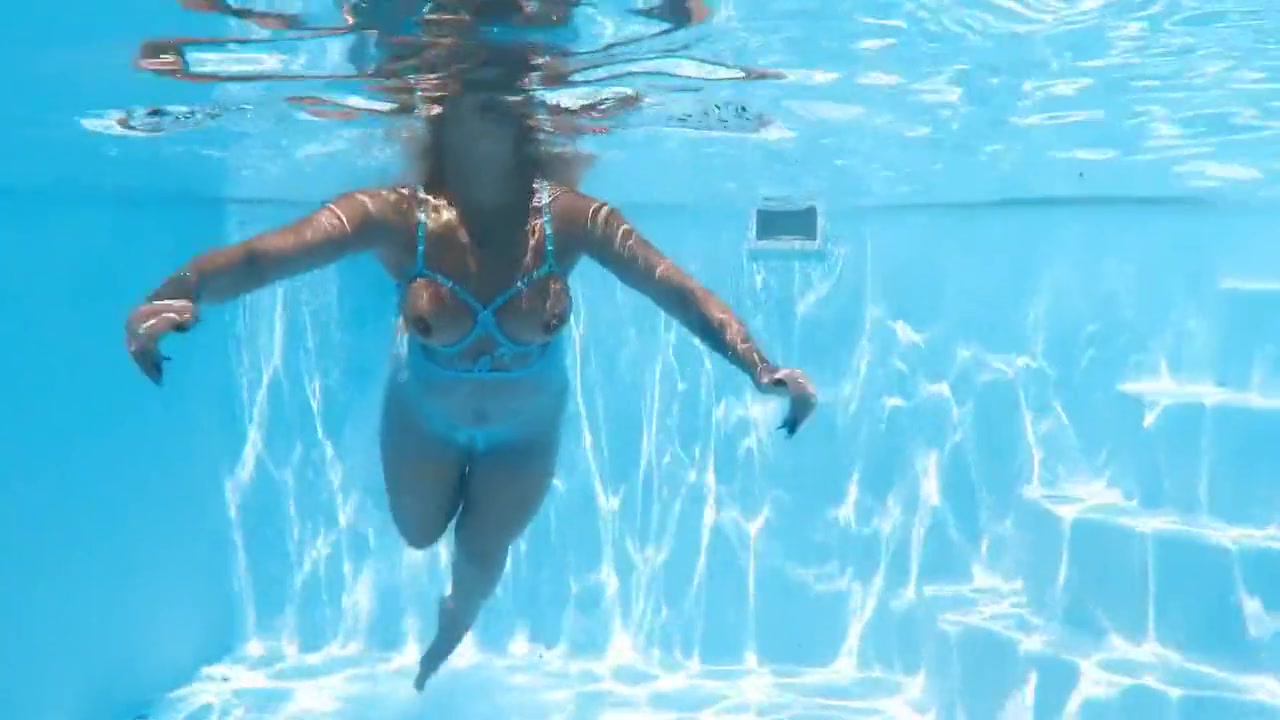 A Woman Floats In A Butterfly-adorned Mesh Dress
