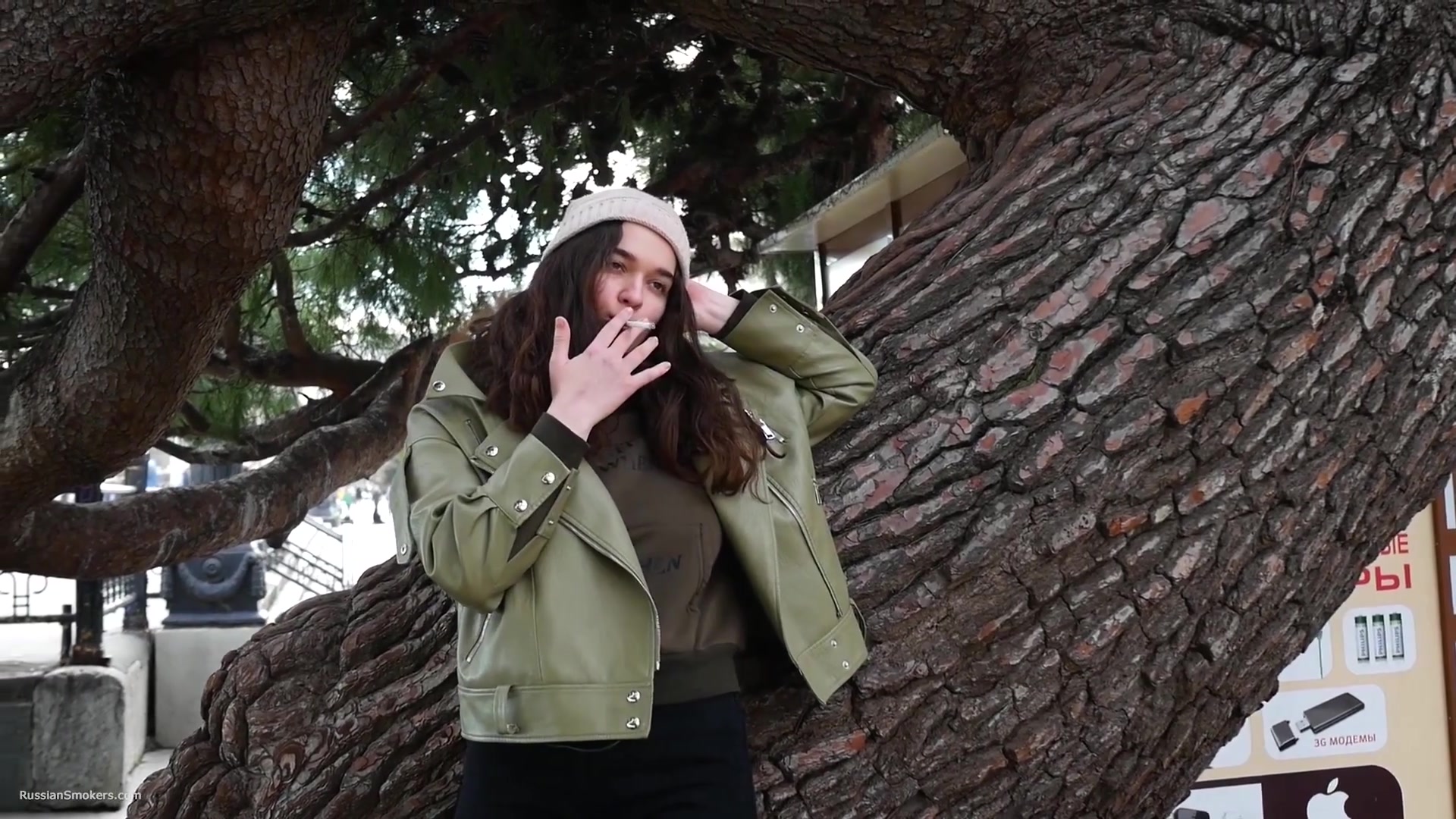 Young Brunette Is Taking An Unhurried Stroll With Allwhite 120mm Cigarette