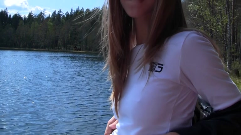 Youthful pair walking in the woods drilled