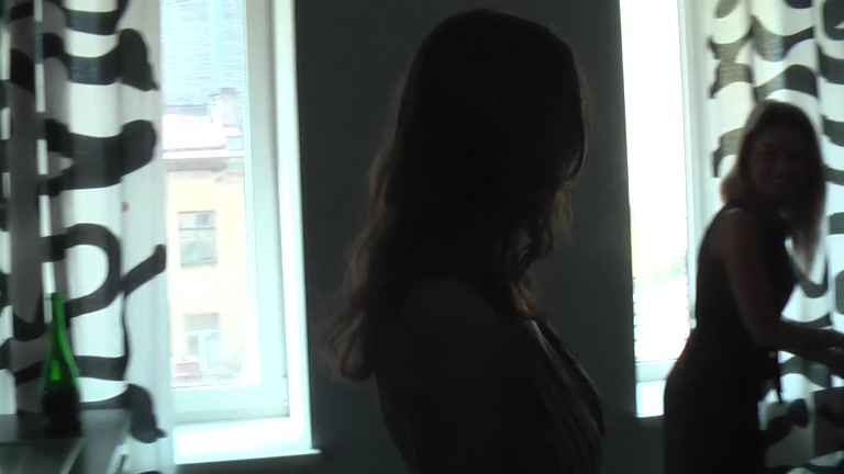 Lesbians prepare dildos for sex session