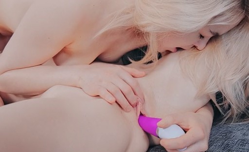 Playful cuties lick and suck a sex toy as foreplay