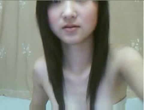 Petite Chinese girl with little tits stimulates sensitive vagina