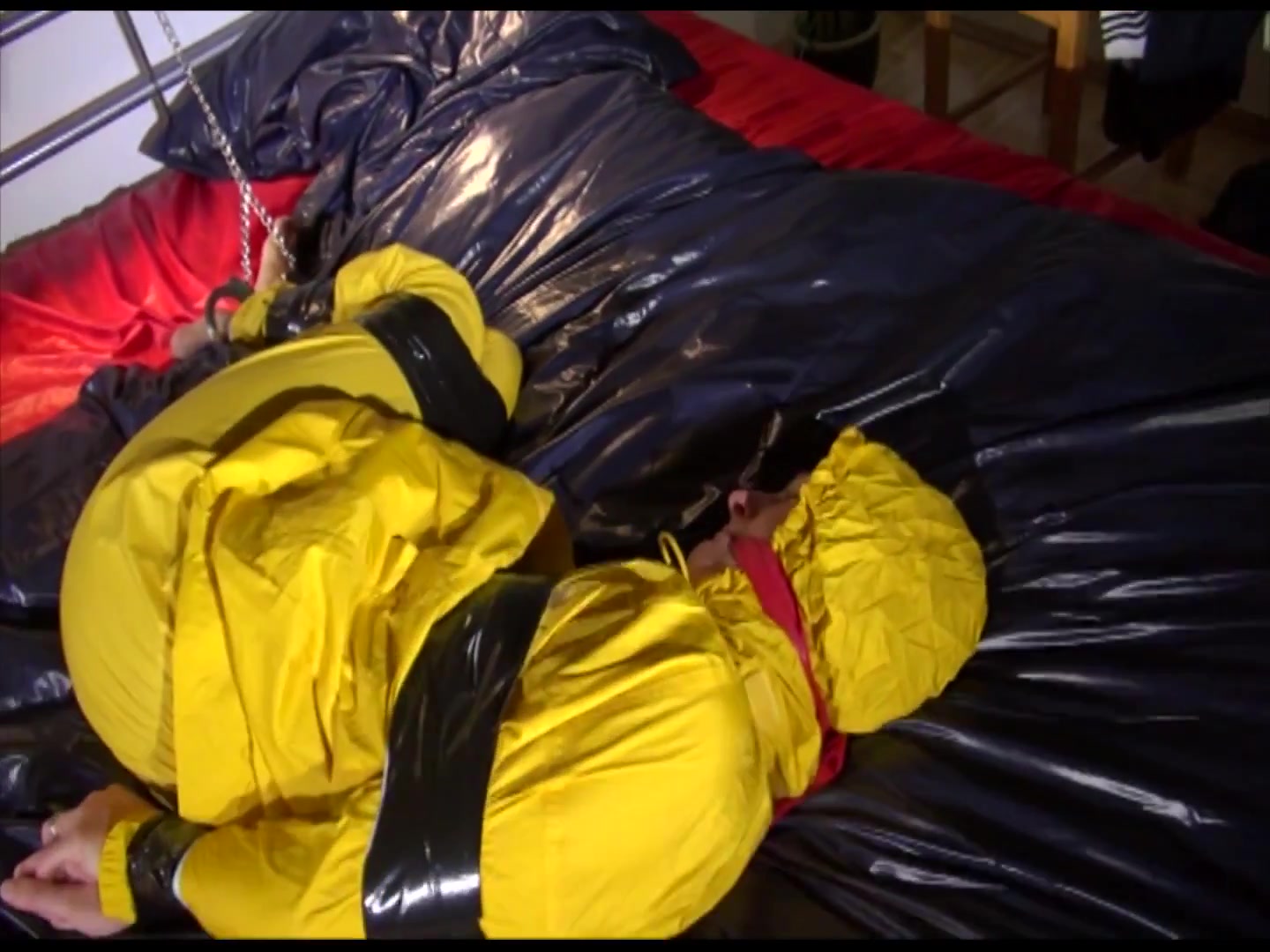Get 2 Archivevideos With Sonja Enjoying Bondage In Her Shiny Nylon Rainwear