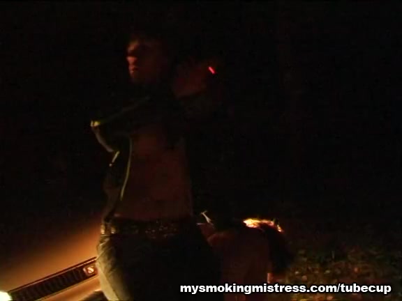 Smoking Mistress Sits on Slave