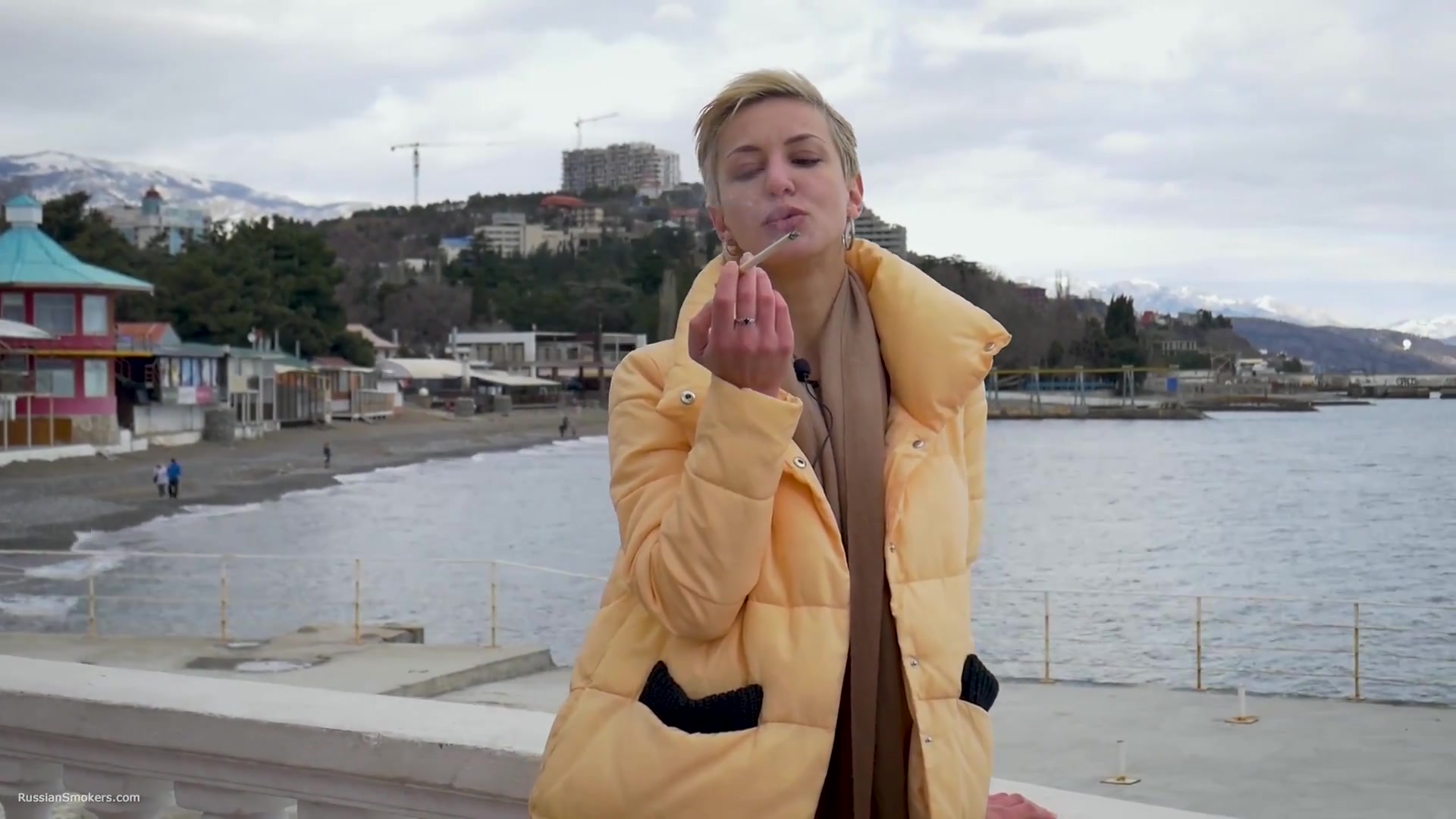 Short Cut Hair Blonde Girl Is Smoking Two Cork Cigarettes