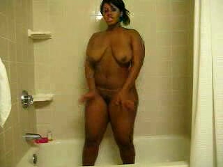 Ebony bitch with curves washes her brown twat in the shower