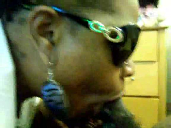 Black slut with sunglasses takes cock deep in her mouth